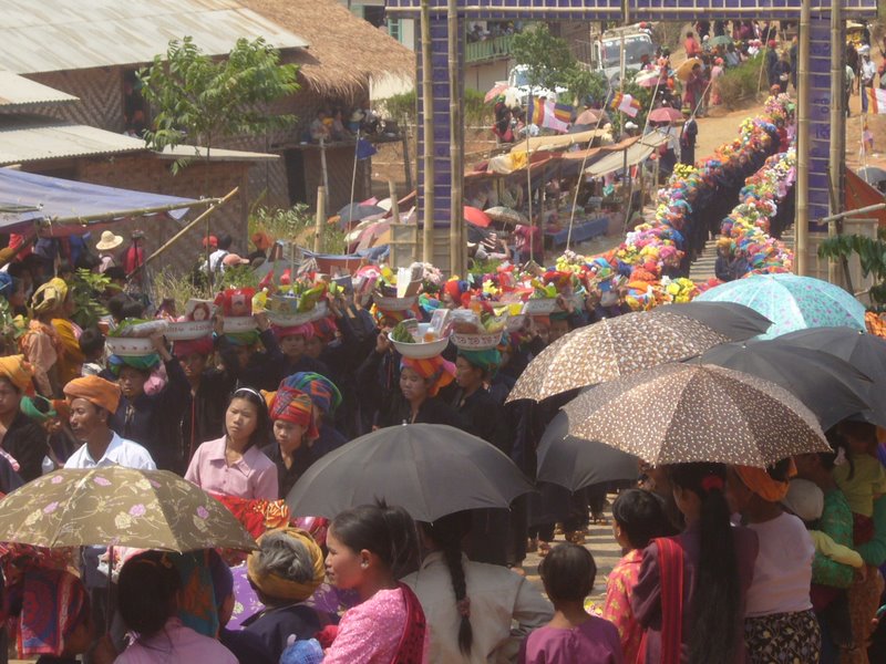 Women bearing gifts for the monastery and the novices come first.